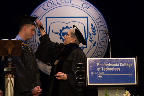 The tassel of student speaker Lewis D. Robinson gets the presidential treatment in turning. 