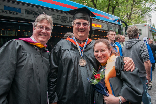 Technology management grad Crystal L. Butler (who also holds degrees in culinary arts technology and baking and pastry arts), celebrates with Chefs Frank M. Suchwala and Paul E. Mach, assistant professors of hospitality management/culinary arts.