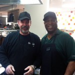 Teamed with Dining Services' Lee R. Whittington (right) as this year's "guest flipper" is David Kay, vice president for college services ...