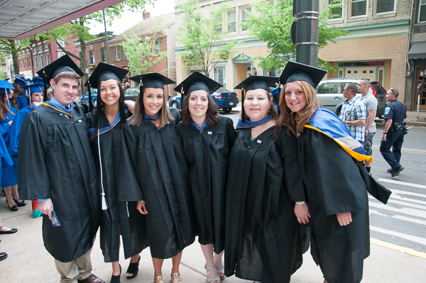 Applied human services degree candidates seek one last photo together as students.