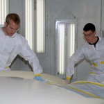 Two more May graduates – Ryan J. Levesque (left), of Unionville, and Carmen Cicioni, of Ringtown – remove wax and grease ...