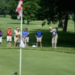 Members of the gallery watch how it's done.