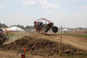 Benjamin D. Lopatofsky, a manufacturing engineering technology major from Williamsport, navigates the college's car during the four-hour endurance race at Baja SAE-Kansas.  He and his teammates came in third, the highest finish Penn College has recorded in the marquee event at the Baja SAE competition. 
