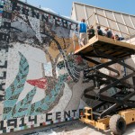 The Centennial mosaic, a collaborative project outside the Physician Assistant Center, nears completion.