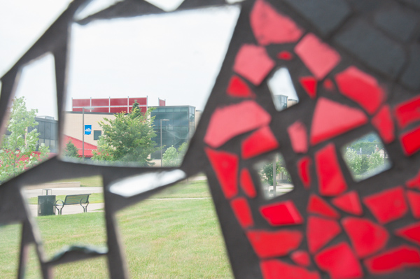 The campus is reflected in the mosaic's mirrors. 