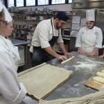 Kris Patterson, of the Penn State Bakery, demonstrates the classic baguette.