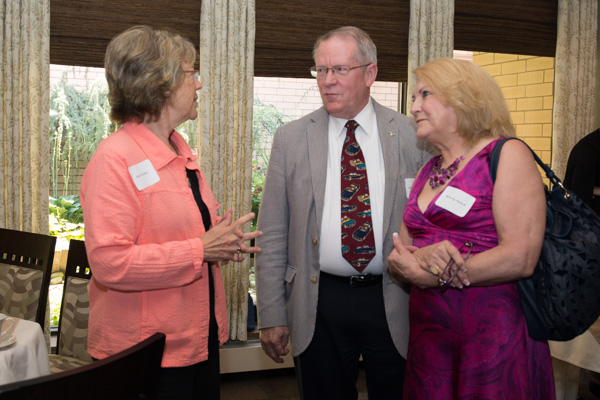 Kate D. Hickey, director of the college library from 1983-96, chats with Russell C. Mauch, dean for community and continuing education from 1978-84, and his wife, Beverly.