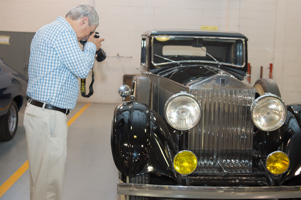 Another avid photographer in the group is James E. Middleton, vice president for academic affairs/provost, 1990-93, capturing a close-up of a restored Rolls-Royce. 