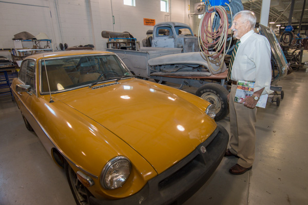 William C. Bradshaw, a sports car enthusiast and former director of experiential learning and career services, eyes an MG on loan from K&T Vintage Sports Cars in Allentown. 