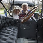 Winfield Tannehill, '57, and his wife, Dorothy, peek through one of the vintage cars on display in conjunction with the Automotive Centennial.