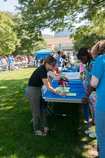 Tables line the ATHS mall, inviting students to embrace campus organizations and community connections.