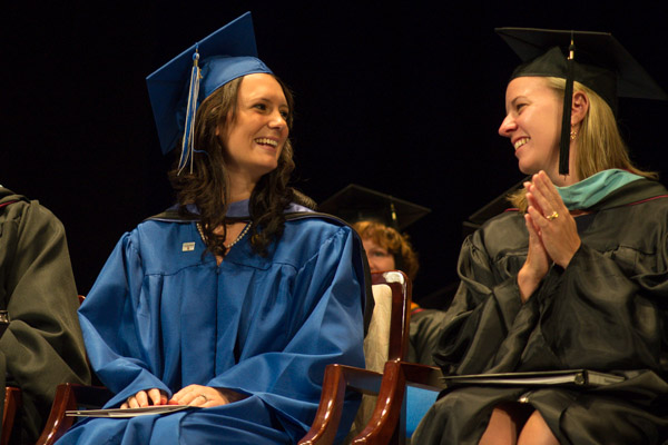 After finishing her speech, Savidge shares a relieved moment and laugh with Carolyn R. Strickland, vice president for enrollment management/associate provost.<br />
