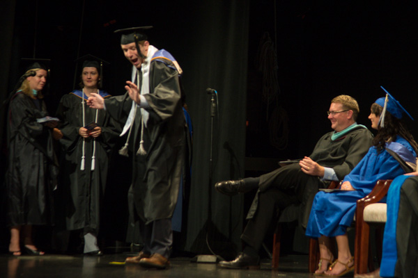 Matthew J. Freer, a physician assistant graduate from Creedmoor, N.C., jubilantly soft-shoes across the stage.<br />
