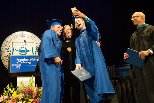 Shawn T. Knapp, of Auburn, New York, and Luke C. Laughlin, of Butler - both graduating in heavy construction equipment technology: technician emphasis - went out on stage in tandem and 