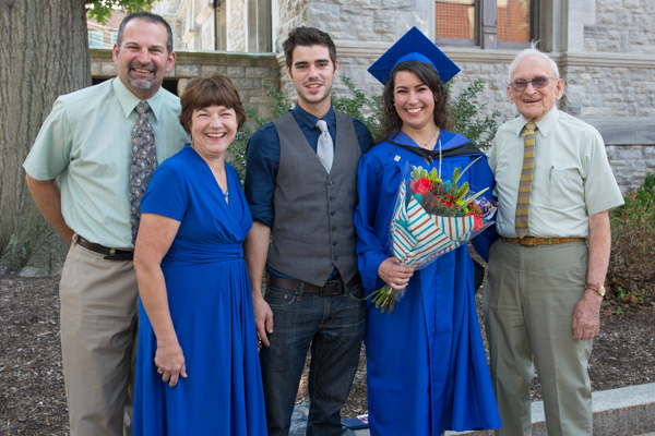 Katelyn E. Watson, a radiography grad from Turbotville, marks the day with a true Penn College legacy family, including her father, Chip (far left), a 1980 Williamsport Area Community College graduate who majored in heavy construction equipment.  