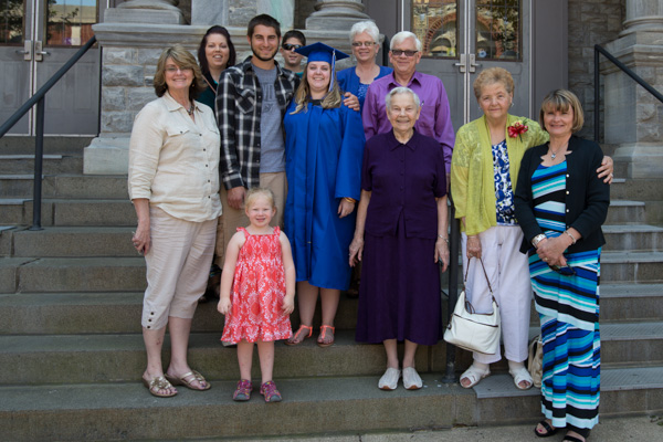 The steps of City Hall make a great spot for a photo of the many fans of Marcia E. Shives, of State Line, a <br />
<br />
graduate in health arts: practical nursing emphasis. 