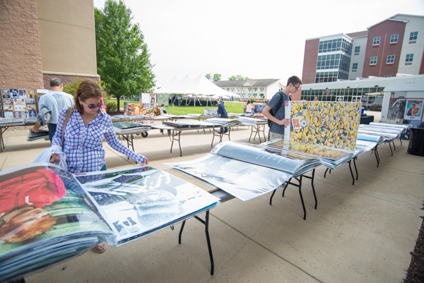 A large poster sale attracts the interest of many, including Brett D. Aldinger and his parents. Aldinger is a masonry freshman from Easton.