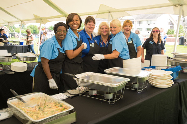 Cheerful Dining Services employees pause for a fun photo before serving the masses.