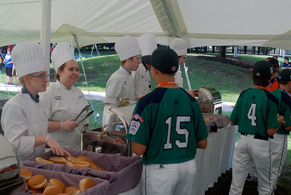 Students from the School of Business & Hospitality serve up a variety of cookout fare that proved popular with all teams, no matter their home cuisine.