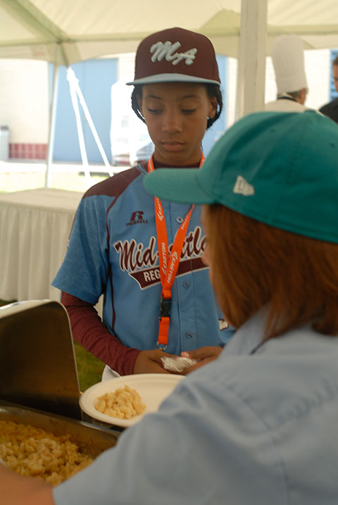 Mo'ne Davis,who pitched Philadelphia's Taney Dragons into the Little League Baseball World Series, fortifies her throwing arm with another helping of homemade macaroni and cheese.