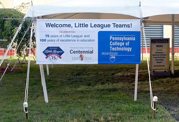 A banner by the food tent welcomes World Series teams (and marks the year's special anniversaries for Little League and Penn College).