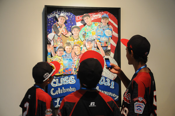 The three-dimensional work of area elementary students is appreciated by campus visitors.