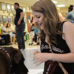 Resident assistant Kristen E. Bowes, a web and interactive media major from Wayne, meets "Hershey," a perfectly named chocolate Labrador retriever owned by Karen E. Wright, graduation assistant in the Registrar's Office.