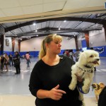 Career Services secretary Shawnalee E. Miller and "Gus," a Maltese who helped put students at ease