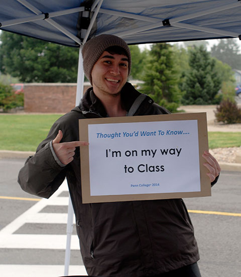 Striking a playful pose, Rodrigo B. Main, a pre-physician assistant student from Mountain Home, Idaho, stops by a Wildcat Welcome tent while gearing up for his First Year Experience class.