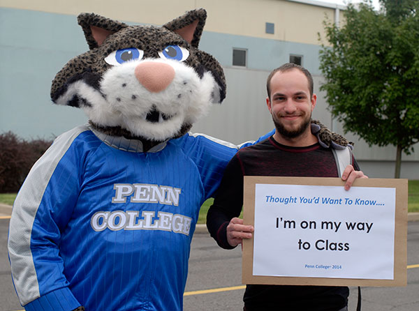 Erik D. Stengline, a welding and fabrication engineering technology student from Moosic, makes a new friend on his transfer to Penn College.