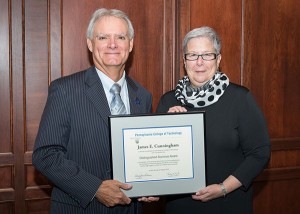 James E. Cunningham receives congratulations from Penn College President Davie Jane Gilmour for his Distinguished Alumni Award.
