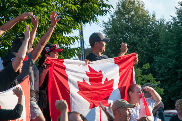 Canada fans pull out their cameras as their favorite team nears …