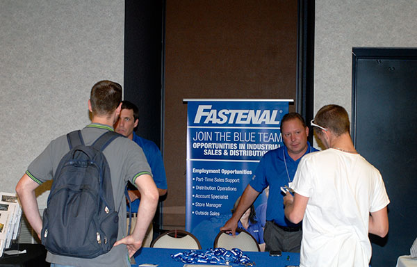 Fastenal's Scott Hummel (left) and Mike Bowen talk with students about their company, with a local office just across the river from main campus.