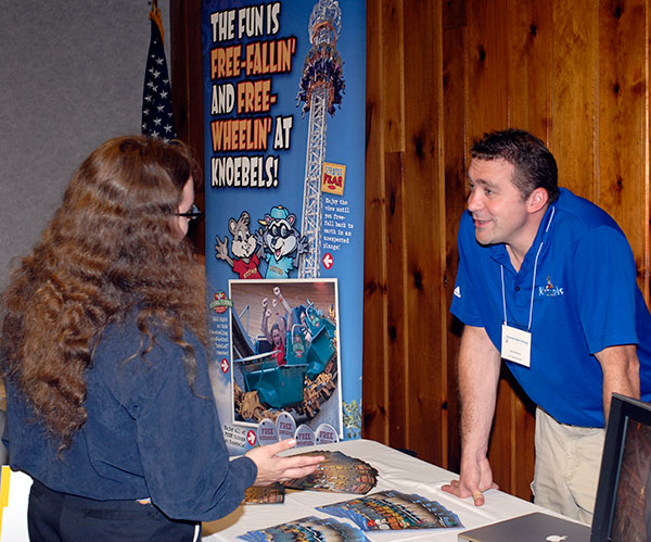 Jon Anderson, human resources manager for H.H. Knoebel and Sons Inc., talks with Damon K. Shoemaker, an electronics technology major from Easton, about employment options at the popular amusement park.