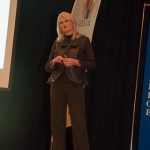 A Centennial banner is a timely backdrop for the colloquium.