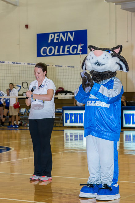 Jami Hughes, assistant director of athletics/sports information director, with the Wildcat in Bardo Gym.