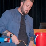 Adding a visual aid to his vivid storytelling, Vaughn “toasts” bread.