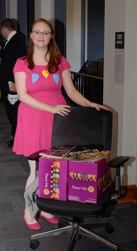 ... and his fiancee, 2014 graphic design alumna Crystal J. Broscious wins a prize package that includes Frito-Lay snacks and a HON chair.