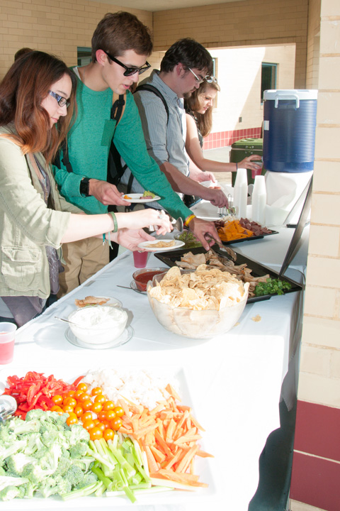 Student artists line up for reception sustenance on the Campus Center patio.