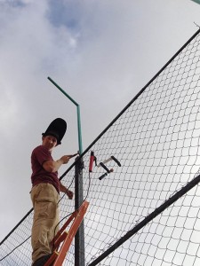 Penn College student George W. Settle III, of Dillsburg, works to add a vertical extension to a playground fence at Home of Hope, a facility for street children near Beirut, Lebanon. 