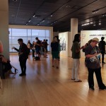 A crowd of about 150 patrons visits the Gallery at Penn College for the exhibit's opening. 