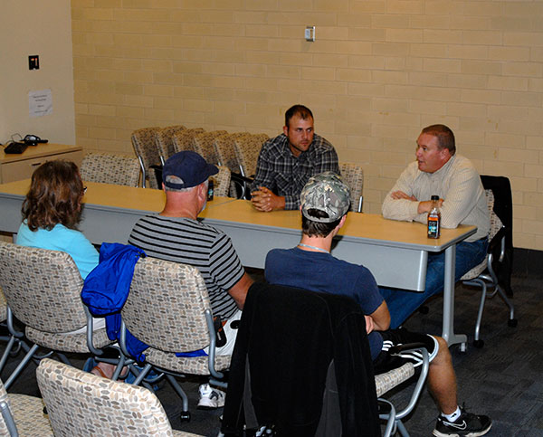Horticulture students and their families dropped into a Campus Center conference room for career advice from 2013 alumnus Jeremy L. Thorne (left), an installation foreman with Scott's Landscaping Inc. in Centre Hall, and faculty member Carl J. Bower Jr.