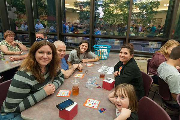 Courtney M. McCartan (left rear), of West Mifflin, who majors in the dental hygiene-health policy and administration concentration, enjoys bingo with the family.