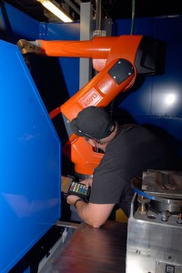 ... who quickly applies his newly gained knowledge inside the robotic-welding workstation.