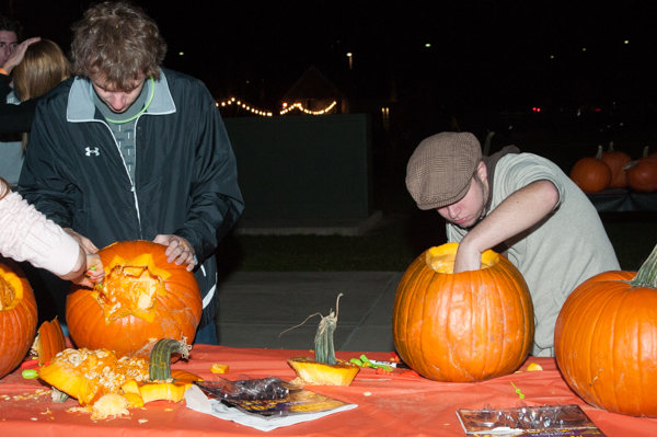 Contestants try their hands at carving pumpkins ...