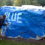 As her Blue Crew colleagues head to class and work, Eisely stays behind to paint a challengingly uneven "canvas."