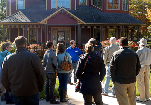 A tour group learns about the Victorian House, dedicated in 1997 after years of involvement by students in a variety of majors ...