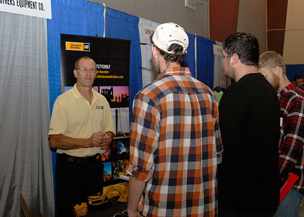 Randy Fetterolf, of Cleveland Brothers Equipment Co. – one of the regional Caterpillar dealers with a longtime connection to Penn College – interacts with students from the Schneebeli Earth Science Center.