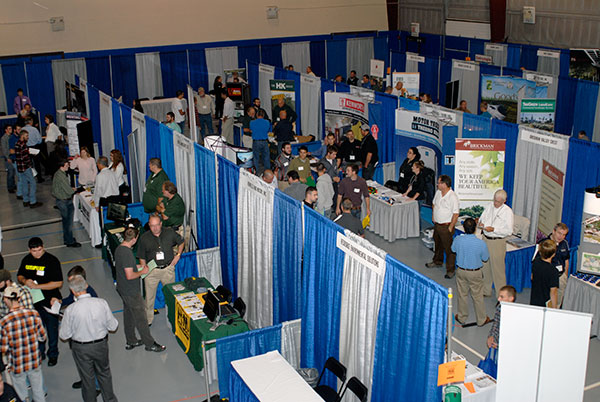 Students move among the varied vendors on the Field House floor during the relocated Career Fair for natural resources technologies majors.
