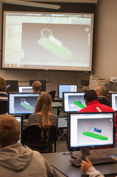 Students receive an introduction to engineering design and computer-aided drafting by building “The Wildcat” rollercoaster.